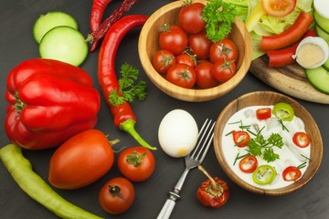 Fresh vegetables for snacks with dressing. Dip for vegetables. Healthy diet meal for dinner. Preparing vegetables in a home kitchen.
