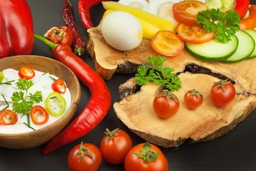 Fresh vegetables for snacks with dressing. Dip for vegetables. Healthy diet meal for dinner. Preparing vegetables in a home kitchen.
