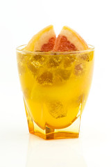 orange and grapefruit juice in glass ower white background
