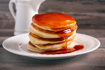 Honey over stack of pancakes