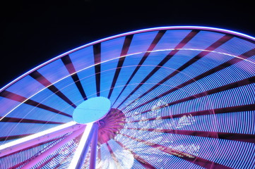 Spinning ferris wheel at night light