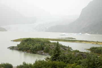 Obraz premium Mendenhall Glacier in a misty day - USA Alaska, Tongass National Forest, Mendenhall Glacier Recreation Area, Travel destination