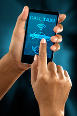 Woman's Hand Booking Taxi On Smart Phone
