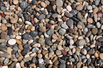Beach stones closeup as background