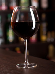 Glass of red wine at the bar