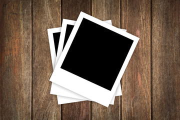 photo frames on wooden background