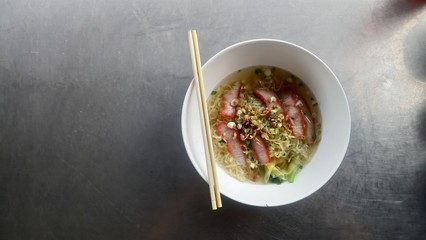 egg noodle wonton on stainless steel table with copy space
