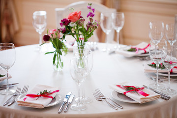 Wedding banquet, small restaurant floral, decor in red, informal style.