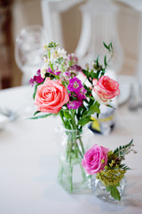 Wedding banquet, small restaurant. Floral decor in red, informal style.