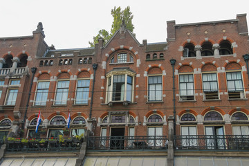 Fototapeta premium Old style brick building in historic city centre. Amsterdam, Net