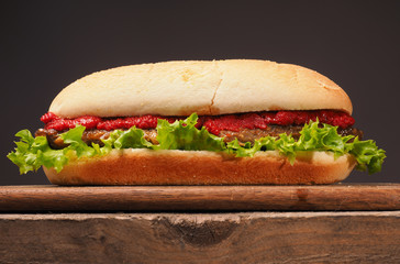 Burger on a rustic wooden table