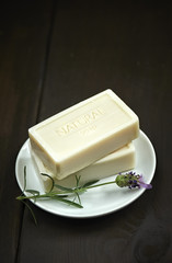 Natural soap bars over dark wooden background. Spa concept.