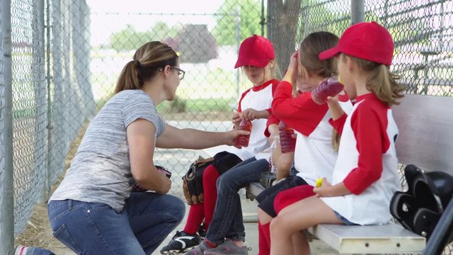 Little league team drinking and eating snacks