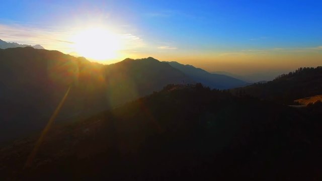 Sunrise over mountains Nature background aerial video 4k. Sunset Sunshine in Himalayas Nepal. Sun rises on clear sky.