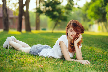 Naklejka na ściany i meble woman relaxing in the park
