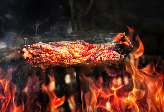 steak with flames on grill