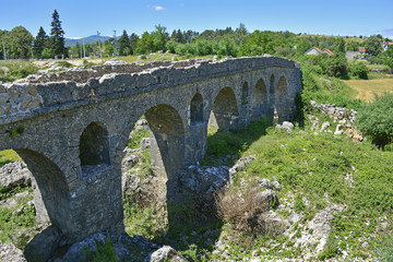 Fototapeta na wymiar A third century Roman bridge over the River Mostanici near to Nicsik in Montenegro 