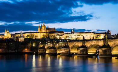 Fototapeta na wymiar Prague Castle with charle's bridge in twilight with dramatic sky