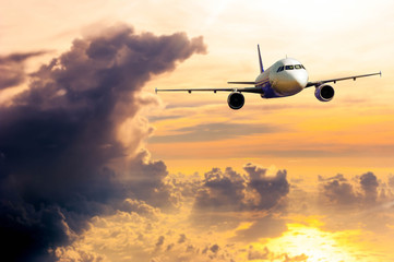 Fototapeta na wymiar Airplane with background of cloudy sky in golden time, explorati