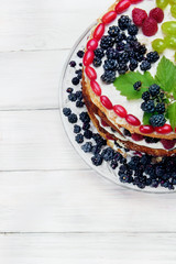 Cake with whith, fruits (grape) and berries (raspberry and black
