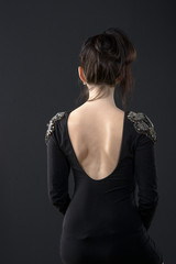 Fototapeta premium young women back on black background