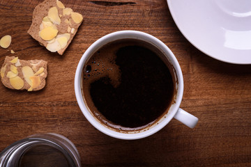 cup of black coffee and cookies