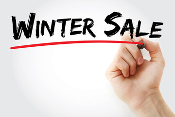 Hand writing WINTER SALE with marker, concept background