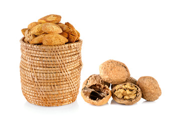 almonds and walnut and a cracked walnut isolated on the white ba