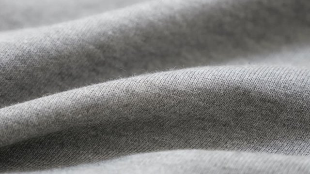 Sweat shirt or pants fine gray fabric texture close-up 4K 2160p 30fps UltraHD tilting footage - Cotton and polyester pattern of training cloth slow tilt 4K 3840X2160 UHD video