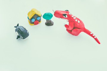 Creative dinosaur, whale, house and tree clay model. Play dough animals.