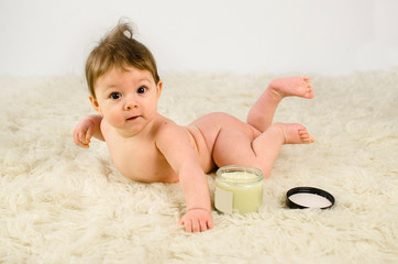 cute baby girl naked with cream