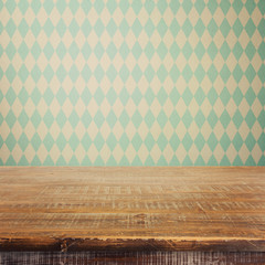 Empty wooden rustic table over bavarian pattern wallpaper. Oktoberfest beer festival concept