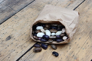 Multicolored bean in paper bag