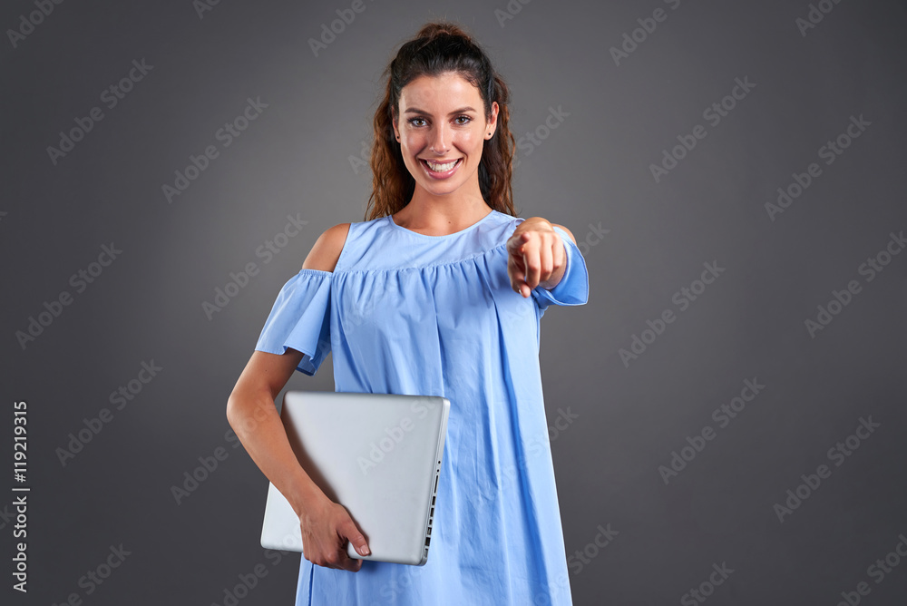 Wall mural young woman with laptop