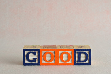 The word good spelled with colorful blocks 