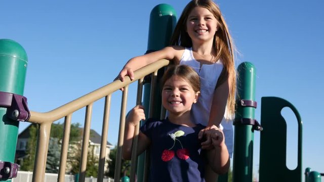 Portrait of two girls on playground