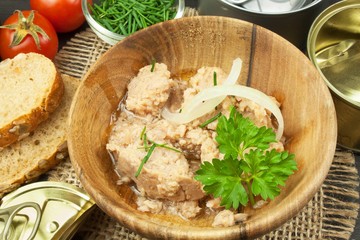 Crushed tuna canned. The fishing industry, canned fish. Diet food. Tinned tuna. Bowl with canned Tuna. Domestic food preparation.

