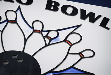 aged and worn vintage photo of bowling alley lanes sign