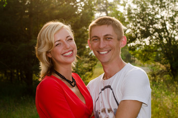 Happy couple walking and laughing in a park