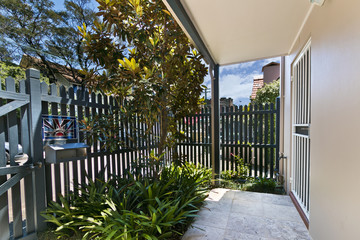 Fototapeta premium back yard with outdoor seating and barbecue with family