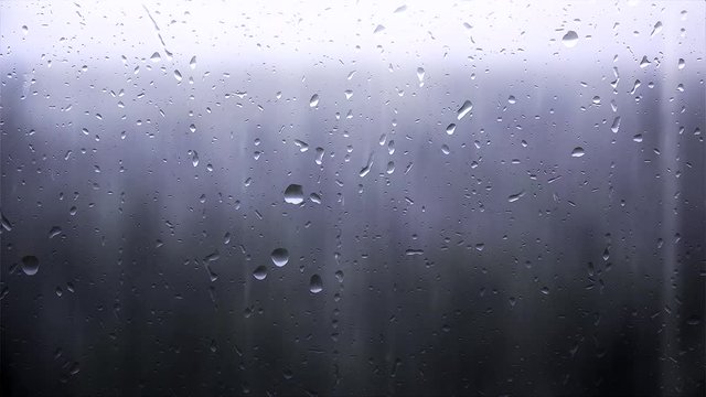Strong rain through window glass.