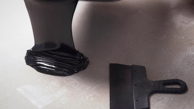 repairs with a spatula and bitumen