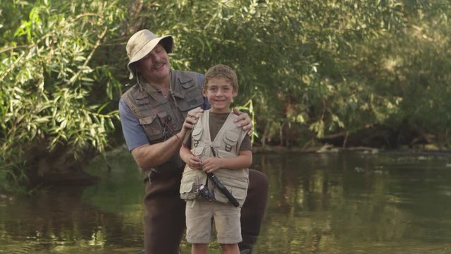 Portrait of father and son fishing