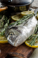 Fish with spices. A vertical image.