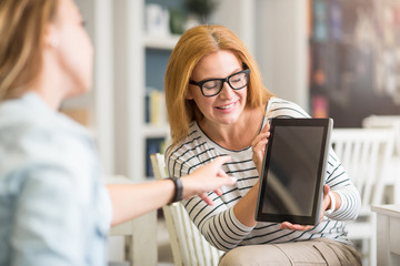 Positive colleagues using tablet