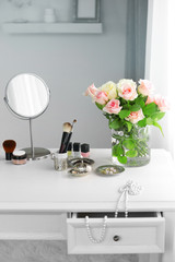 Cosmetic set on light dressing table
