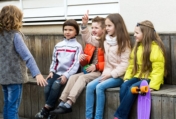 Little kid acting out phrase to friends