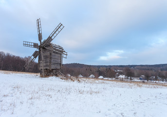 Traditional wooden ukrainian windmill in winter