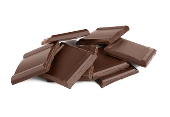 Pile of dark chocolate tiles isolated on white