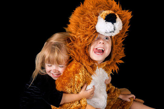 Little Cat Girl Hugging A Lion Girl